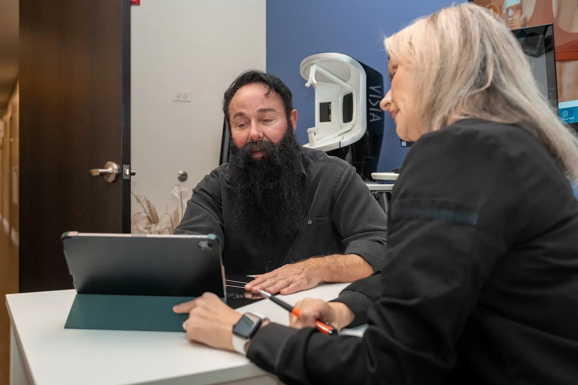 Patient consulting with dermatologist about oral minoxidil for hair loss at DSI Hair in Algonquin, IL