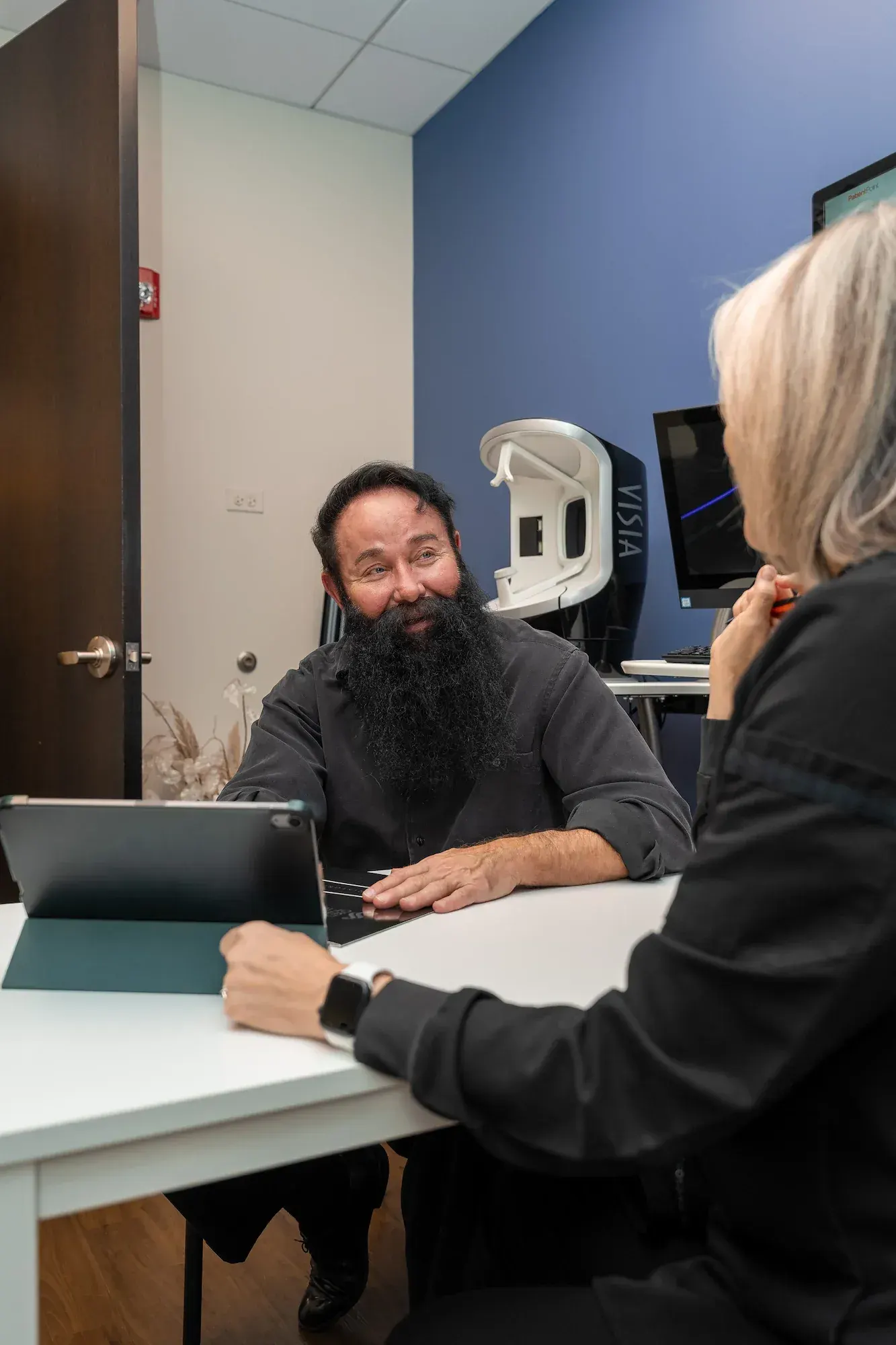 Confident patient considering laser cap for hair growth at DSI Hair
