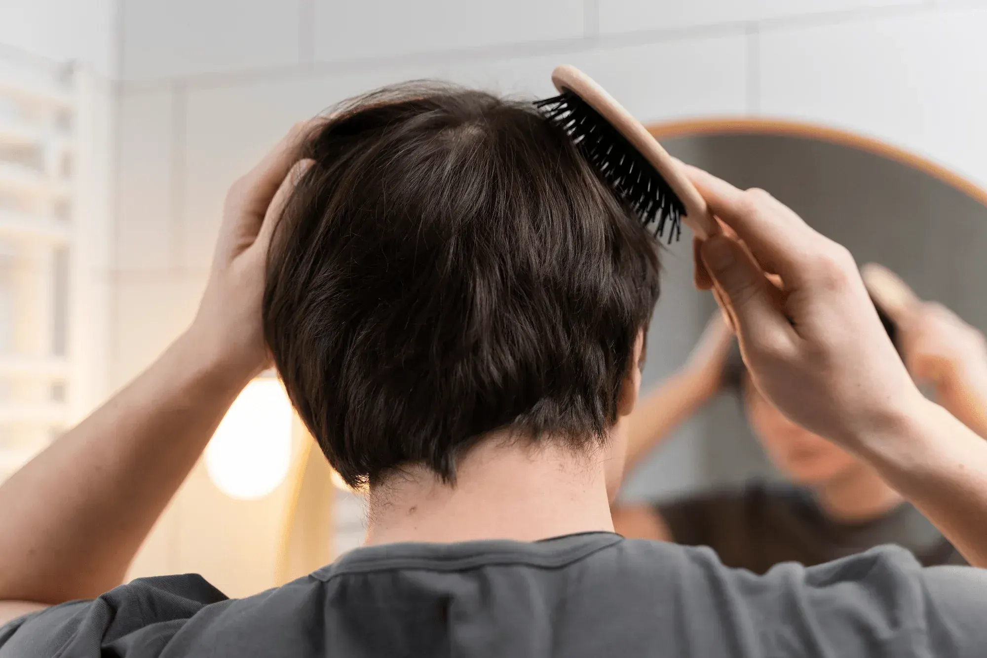 DSI Hair dermatology provider in Algonquin Illinois reviewing minoxidil application results with a male patient at a 6-month follow-up appointment